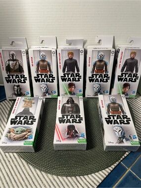8 boxes of Star Wars Figures in White Packaging with Green Accents, ( brand new)